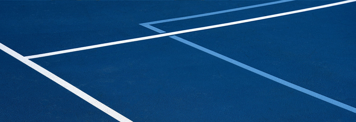Indoor badminton courts shown in the PolyTurf installation guide